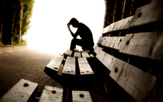 types of self-destructive behavior, self-destructive - man on wooden bench