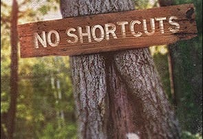 sign on tree reading: no shortcuts