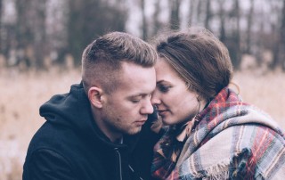 young couple outside during winter