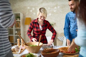 Enjoying-Your-First-Sober-Holiday-Season - friends setting holiday table for meal