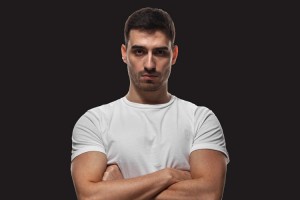 Masculinity, Trauma, and Addiction: Breaking the Cycle of Toxic Masculinity to Get Men the Help They Need - man with arms crossed