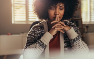 pretty thoughtful African American woman with eyes closed - urge surfing