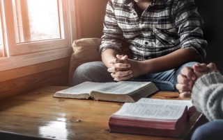 two men holding bible study - spirituality