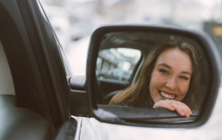 Girl in Car Smiling- Recovery