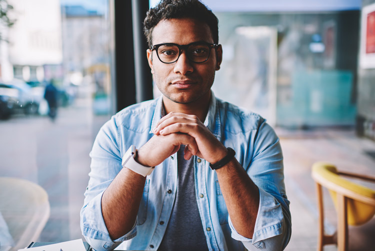 handsome man in glasses looking directly at the camera - addiction is not a choice