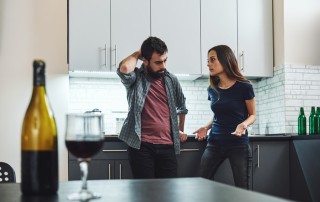 woman mad at man over drinking - family members